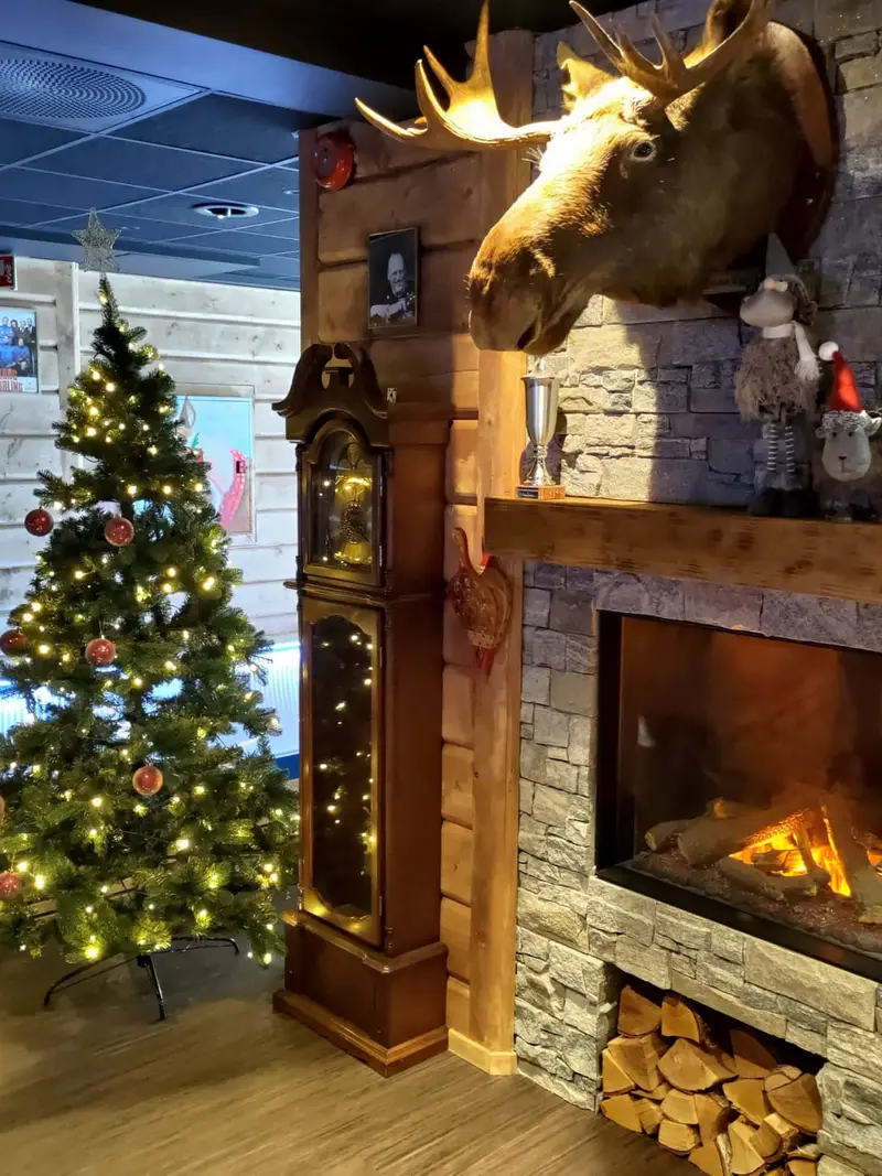 Christmas tree by the fireplace at Fjellstua
