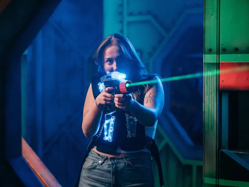 Player taking aim in the laser tag arena